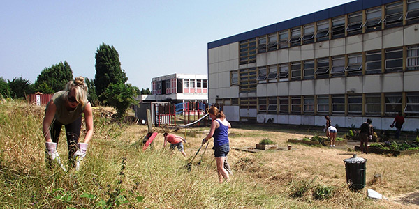 Volunteers planting a community growing scheme